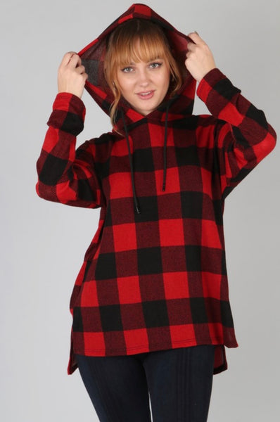 Model wearing our Black & Red Buffalo Plaid Hoodie. Hoodie has a small slit on either side at the bottom and black ties. The sweatshirt is legging friendly. 