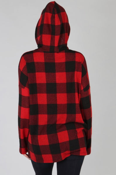 Model wearing our Black & Red Buffalo Plaid Hoodie. Hoodie has a small slit on either side at the bottom and black ties. The sweatshirt is legging friendly.  
